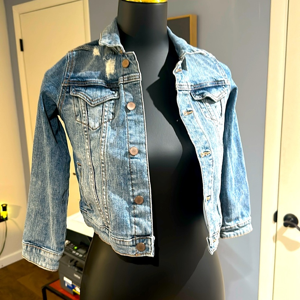 Girls gently used distressed denim jacket size 6/6x.
